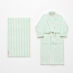 Striped robe and towel set on a white background