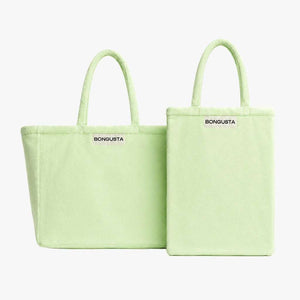 Two light green BONGUSTA tote bags shown on a plain light gray background, one in a standard rectangular shape and one in a slightly larger square-like variant, both with top handles and the BONGUSTA logo printed in black near the top.