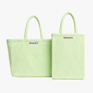 Two light green BONGUSTA tote bags shown on a plain light gray background, one in a standard rectangular shape and one in a slightly larger square-like variant, both with top handles and the BONGUSTA logo printed in black near the top.