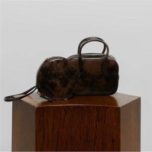 MINI CHARM BAG IN LEATHER