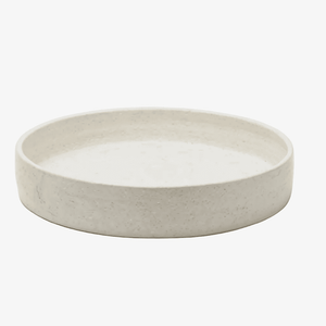 A round, shallow ceramic tray with a textured, speckled off-white finish, photographed on a clean white background.